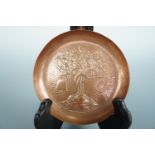 A Keswick School of Industrial Art copper dish decorated in iconography of Saint Kentigern, 11 cm [