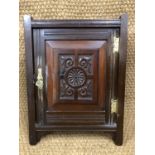 A Victorian carved mahogany aesthetic period corner cabinet, 57 cm high
