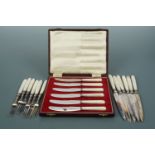 A set of Victorian mother-of-pearl handled fruit knives and forks together with a cased set of