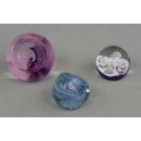 Three Caithness glass paperweights