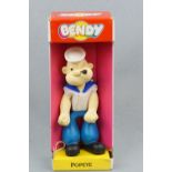 A 1985 Bendy Toys Popeye doll in original packaging, 32 cm