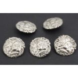 A set of five Belle Epoque rococo silver buttons, each relief-decorated in depiction of the faces of