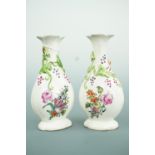 A pair of small Chinese Jingdezhen porcelain baluster vases, believed decorated at the London