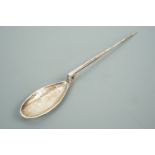 A George V silver anointing spoon modelled after the antique, the bowl bearing an engraved chi-