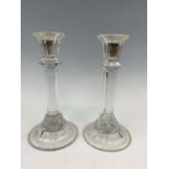 A pair of glass candlesticks, 25 cm high