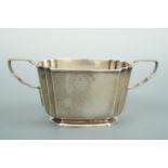 A George V silver sugar bowl, of Art Deco design, having linear indentations, and a pair of square