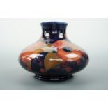 A Moorcroft Pomegranate pattern compressed ballister vase, 10 cm