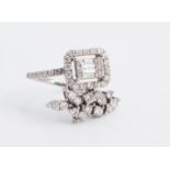 A highly individual contemporary diamond engagement or dress ring, comprising a refined twist-set