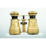 A pair of 19th Century opera glasses, the barrels bearing the message 'Property of U.A.D Co. 29A