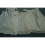 A quantity of late 19th / early 20th Century cotton aprons etc