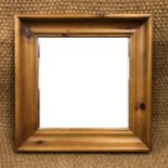 A contemporary pine mirror, 62 x 62 cm