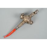 A 19th Century child's white metal and coral soother, rattle and whistle, 12 cm