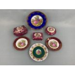 Three Limoges lidded boxes and four Limoges plates