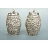 A pair of Anglo-Indian white metal barrel-form pepper pots, tested as silver, 105.6g