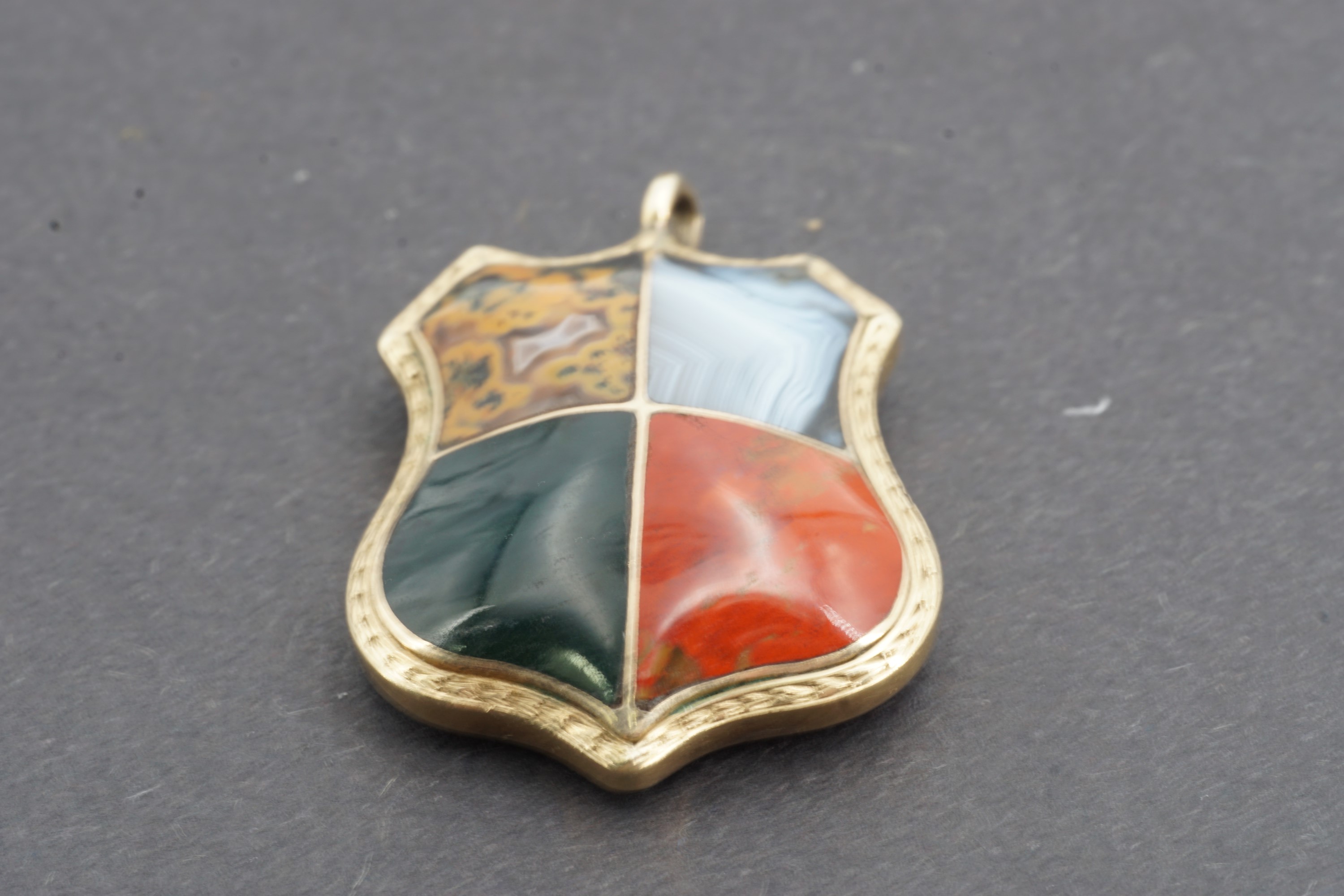 A Victorian yellow-metal 'pebble' and hairwork fob in the form of a shield, the domed and polished - Image 2 of 3