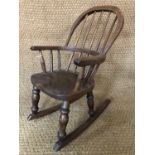 A Victorian child's Windsor rocking chair, 67 cm high
