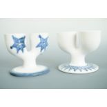 Two Troika Pottery double egg cups, decorated in underglaze blue, 9 cm