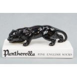 A vintage "Pantherella Fine English Socks" shop display ceramic advertising panther figurine