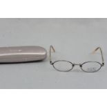 A set of as-new DKNY Ovid designer spectacles, cased (case a/f)