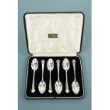 A cased set of six George V silver tea spoons, having shaped and threaded terminals, possibly Joseph