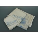 Four 1920s blue-embroidered cotton pillow cases with two single coverlets