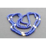 A double-strand pearl, lapiz lazuli and high carat yellow metal necklace, pearls 4 mm, 43 cm