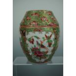 A Qing Chinese Canton type famille-rose covered jar, of ovoid form, decorated with figural scenes,