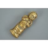 A Scottish novelty / advertising brass vesta case modelled as a swaddled baby, bearing the