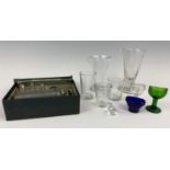 Glass measures and three glass eye baths etc.