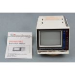 A Binatone Minivision Mk 2 television and booklet