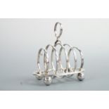 A George V silver miniature toast rack, having circular divisions, Walker and Hall, Sheffield, 1927,
