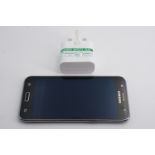 A Samsung Galaxy J5 mobile phone and charger, (factory default settings restored)