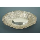 An Elizabeth II silver bon bon dish, of shaped oval section, having a repousse moulded and cased