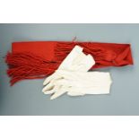 A British army sergeant's scarlet sash together with a pair of kid leather gloves