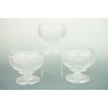Three late Georgian style finely cut glass footed bowls, each having fan-cut inverted rims and