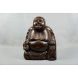 A large wooden seated Buddha, 45 cm high