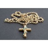 A Victorian yellow metal and turquoise cruciform pendant on chain, having engraved decorated and