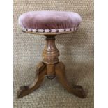 A Victorian walnut piano stool