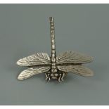 A contemporary pewter pin brooch modelled as a dragonfly, by A R Browne