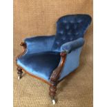 A Victorian carved and button-upholstered mahogany lounge armchair