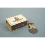 A Royal Artillery celluloid matchbox cover together with a Lord Kitchener tribute medal
