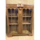 A 1930s - 1940s glazed oak display cabinet