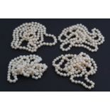 Four princess length single strand necklaces of cultured freshwater pearls, 40 cm, pearls each