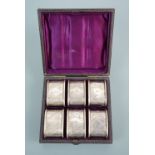 A Victorian cased set of silver napkin rings of Aesthetic design, engraved with geometric bands