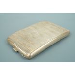 An Edwardian silver cigarette case, of rounded rectangular form, with guilloche engraved and