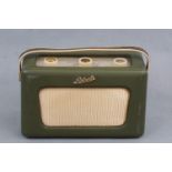 A vintage Roberts R300 portable transistor radio in green