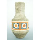An early Troika Pottery 'urn vase', decorated with a band of red and blue roundels over a green
