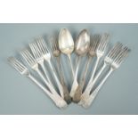 Nine late Georgian Newcastle silver Old English pattern table forks and two spoons, matching