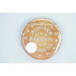 A Huntley and Palmer advertising Vesta case modelled as a biscuit, stamped "Made in Vienna,