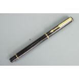 A Parker gilt-and-black ball point pen